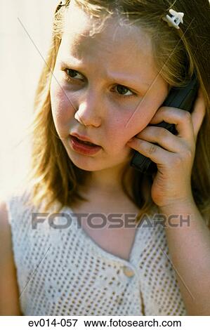 Girl on mobile phone View Large Photo Image Stock Photo - Girl on mobile phone. Fotosearch