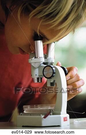Stock Photo - Girl with microscope. Fotosearch