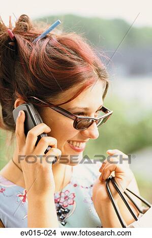 Picture - Girl with mobile phone. Fotosearch