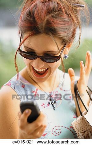 Girl with mobile phone View Large Photo Image Stock Image - Girl with mobile phone. Fotosearch