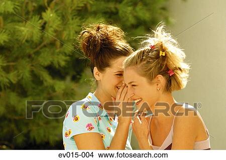 Picture - Girls whispering. Fotosearch