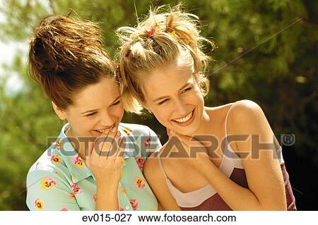 Girls whispering View Large Photo Image Stock Photo - Girls whispering. Fotosearch