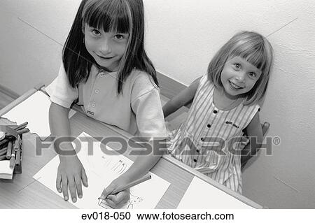 Stock Image - Girls drawing. Fotosearch