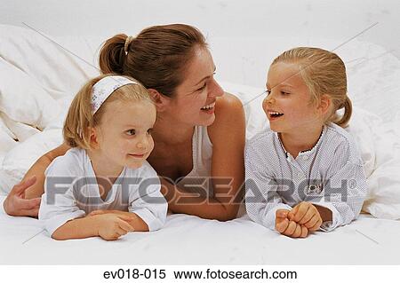 Stock Photography - Mother and daughters. Fotosearch