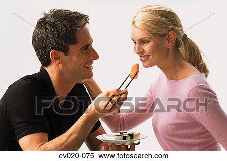Couple eating sushi View Large Photo Image Stock Photography - Couple eating sushi. Fotosearch