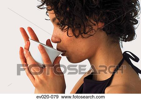 Girl drinking tea View Large Photo Image Stock Photo - Girl drinking tea. Fotosearch