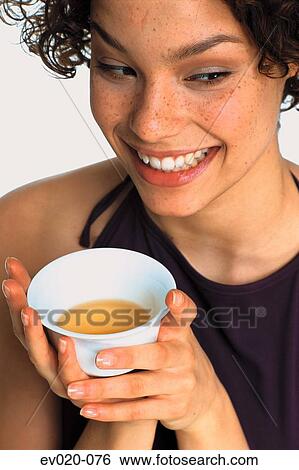Stock Photograph - Girl drinking tea. Fotosearch