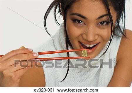 Girl eating sushi View Large Photo Image Stock Image - Girl eating sushi. Fotosearch