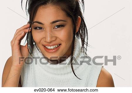 Girl talking on phone View Large Photo Image Picture - Girl talking on phone. Fotosearch