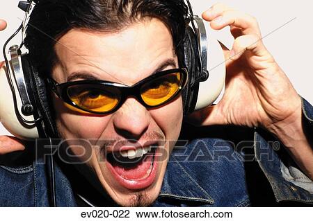 Stock Image - Man listening to music. Fotosearch