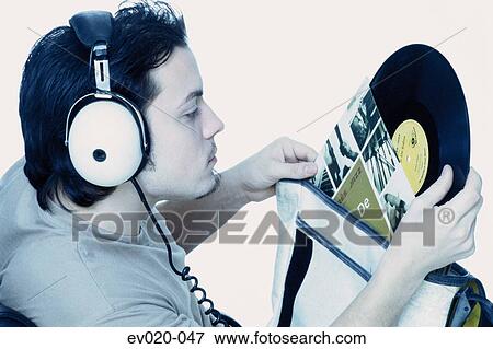 Stock Photo - Man listening to music. Fotosearch