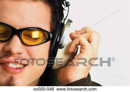 Stock Photo - Man listening to music. Fotosearch