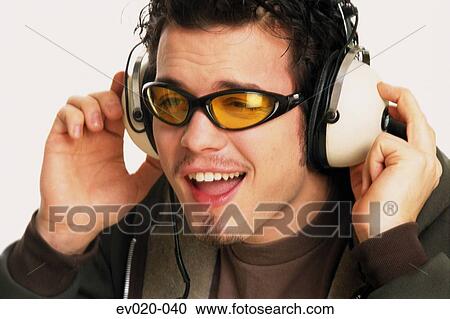Man singing along to music View Large Photo Image Stock Image - Man singing along to music. Fotosearch