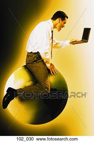 Stock Image - Man on globe. Fotosearch