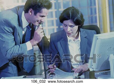 Business couple in discussion View Large Photo Image Stock Image - Business couple in discussion. Fotosearch