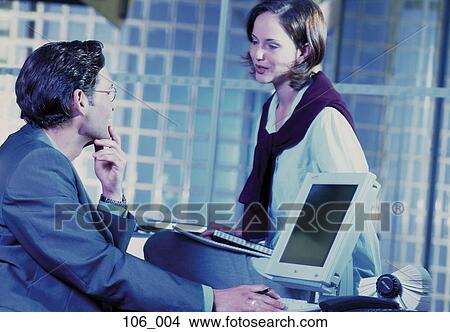 Business couple in office View Large Photo Image Picture - Business couple in office. Fotosearch