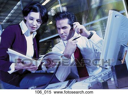 Business couple reading View Large Photo Image Stock Photography - Business couple reading. Fotosearch