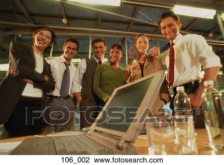 Stock Image - Business people in office. Fotosearch