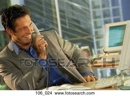 Businessman on phone View Large Photo Image Picture - Businessman on phone. Fotosearch