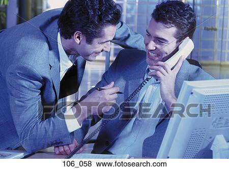 Businessmen in office View Large Photo Image Stock Photo - Businessmen in office. Fotosearch
