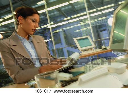 Stock Photo - Woman in office. Fotosearch