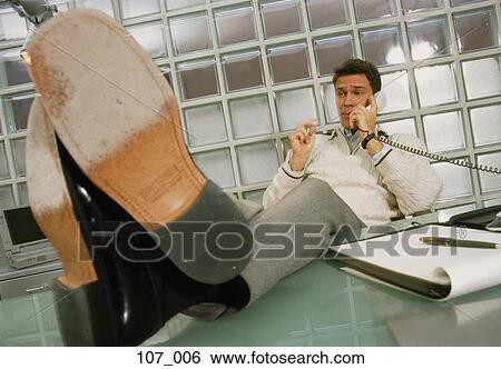 Businessman on phone View Large Photo Image Stock Photograph - Businessman on phone. Fotosearch