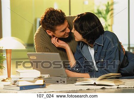 Couple at computer View Large Photo Image Picture - Couple at computer. Fotosearch