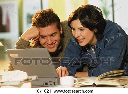 Stock Image - Couple at computer. Fotosearch