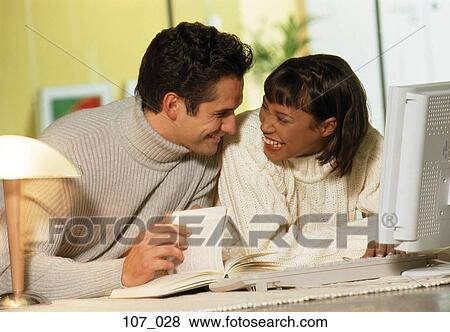 Couple working from home View Large Photo Image Stock Photo - Couple working from home. Fotosearch
