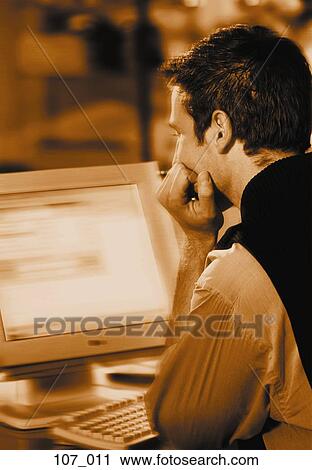Man at computer View Large Photo Image Stock Image - Man at computer. Fotosearch