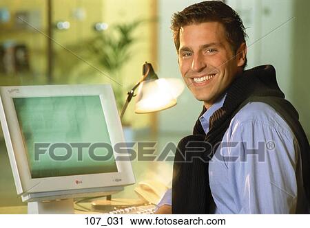 Man at computer View Large Photo Image Stock Image - Man at computer. Fotosearch