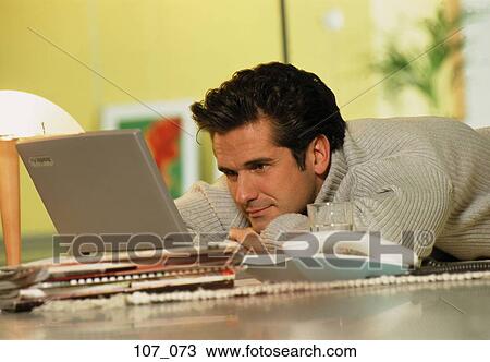 Man at computer View Large Photo Image Stock Image - Man at computer. Fotosearch