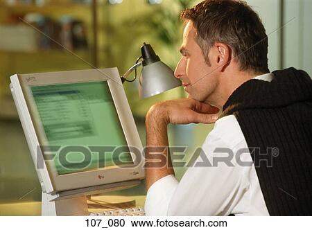 Stock Image - Man at computer. Fotosearch