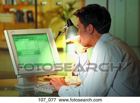 Man at computer View Large Photo Image Stock Photo - Man at computer. Fotosearch