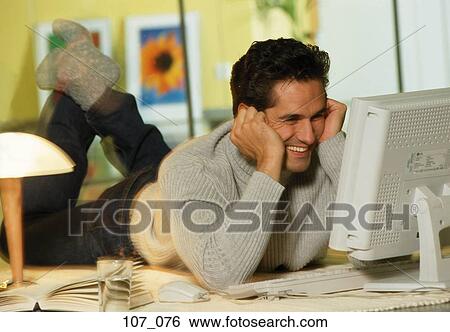 Man at computer View Large Photo Image Stock Photograph - Man at computer. Fotosearch