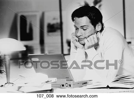 Stock Photo - Man with laptop. Fotosearch