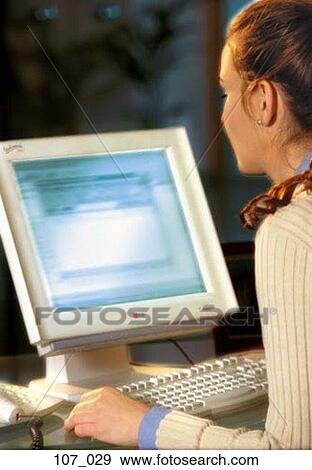 Woman at computer View Large Photo Image Stock Photo - Woman at computer. Fotosearch