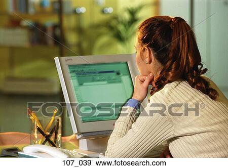 Stock Photo - Woman at computer. Fotosearch