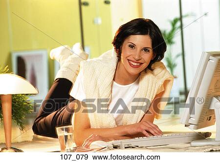 Woman at computer View Large Photo Image Stock Photo - Woman at computer. Fotosearch