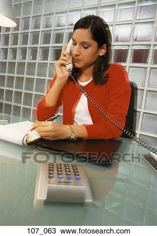 Stock Image - Woman in office. Fotosearch