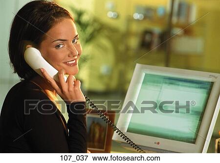 Stock Photo - Woman in office. Fotosearch