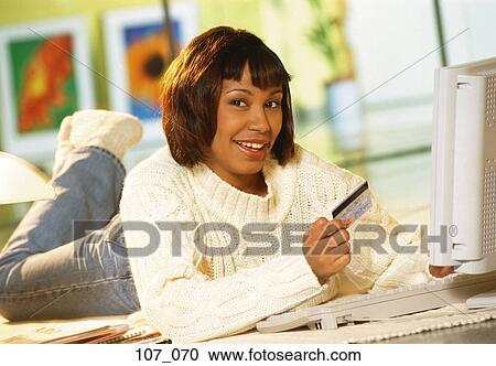 Stock Image - Woman Internet-shopping. Fotosearch