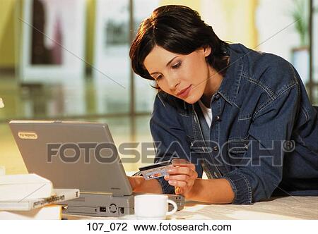 Stock Image - Woman Internet-shopping. Fotosearch