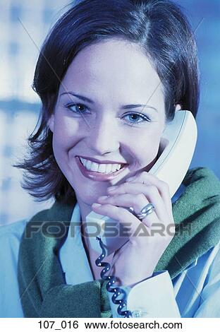 Stock Photograph - Woman on phone. Fotosearch