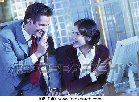 Business couple in office View Large Photo Image Stock Image - Business couple in office. Fotosearch