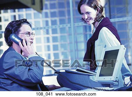 Stock Image - Business couple in office. Fotosearch