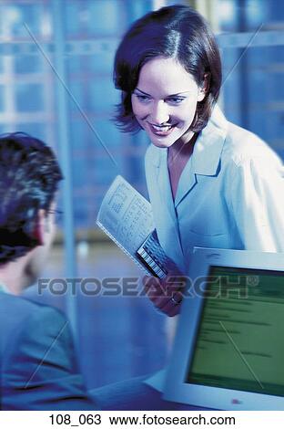 Business couple in office View Large Photo Image Stock Image - Business couple in office. Fotosearch