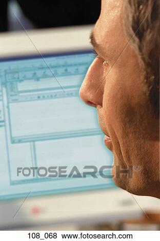 Businessman at computer View Large Photo Image Stock Photo - Businessman at computer. Fotosearch
