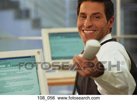 Businessman passing telephone View Large Photo Image Stock Photograph - Businessman passing telephone. Fotosearch