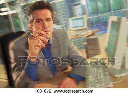 Businessman smoking cigar View Large Photo Image Stock Image - Businessman smoking cigar. Fotosearch